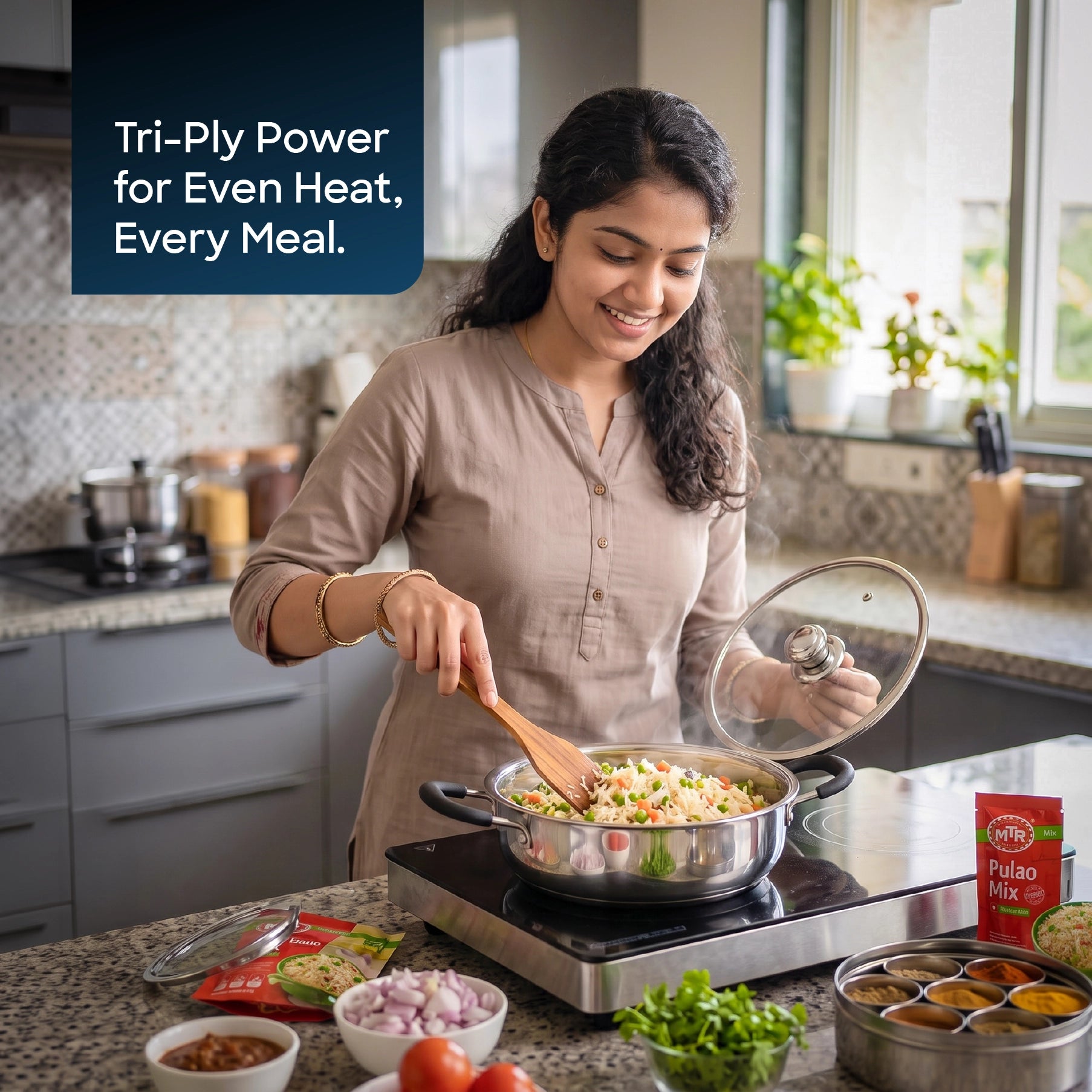 Sanford SF15252MP 24cm Tri-ply Multipan – lifestyle shot, woman cooking in a kitchen